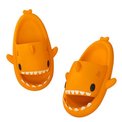 Cartoon Shark Slippers on a green pedestal, showcasing 4cm thick sole and playful shark design.