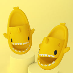 Cartoon Shark Slippers on a green pedestal, showcasing 4cm thick sole and playful shark design.