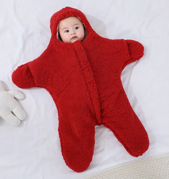 Baby Quilt - Soft & Cozy Newborn baby wrapped in a plush, pink snowsuit on a soft surface.