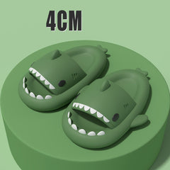 Cartoon Shark Slippers on a green pedestal, showcasing 4cm thick sole and playful shark design.