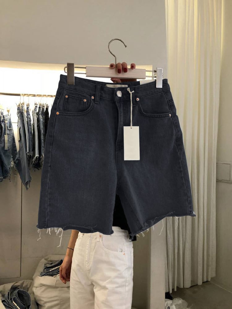 Women's Five-Point Denim Shorts on display, featuring a high waist and loose casual fit, perfect for summer fashion.