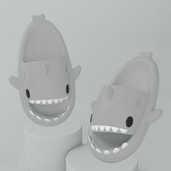 Cartoon Shark Slippers on a green pedestal, showcasing 4cm thick sole and playful shark design.
