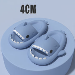 Cartoon Shark Slippers on a green pedestal, showcasing 4cm thick sole and playful shark design.