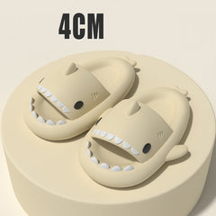 Cartoon Shark Slippers on a green pedestal, showcasing 4cm thick sole and playful shark design.