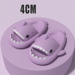 Cartoon Shark Slippers on a green pedestal, showcasing 4cm thick sole and playful shark design.